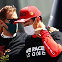 MONTE-CARLO, MONACO - MAY 23: Charles Leclerc of Monaco and Ferrari is comforted by Sebastian Vettel of Germany and Aston Martin F1 Team after discovering he could not start the race during the F1 Grand Prix of Monaco at Circuit de Monaco on May 23, 2021 in Monte-Carlo, Monaco. (Photo by Dan Istitene - Formula 1/Formula 1 via Getty Images)