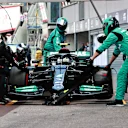 MONTE-CARLO, MONACO - MAY 23: Valtteri Bottas of Finland driving the (77) Mercedes AMG Petronas F1 Team Mercedes W12 makes a pitstop but his front right wheel is stuck on his car leading to his retirement from the race during the F1 Grand Prix of Monaco at Circuit de Monaco on May 23, 2021 in Monte-Carlo, Monaco. (Photo by Mark Thompson/Getty Images)