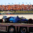 ZANDVOORT, NETHERLANDS - SEPTEMBER 04: The broken car of Nicholas Latifi of Canada and Williams is returned to the pits during qualifying ahead of the F1 Grand Prix of The Netherlands at Circuit Zandvoort on September 04, 2021 in Zandvoort, Netherlands. (Photo by Bryn Lennon/Getty Images)
