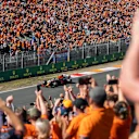 ZANDVOORT, NETHERLANDS - SEPTEMBER 04: Fans celebrate Max Verstappen of the Netherlands driving the (33) Red Bull Racing RB16B Honda during qualifying ahead of the F1 Grand Prix of The Netherlands at Circuit Zandvoort on September 04, 2021 in Zandvoort, Netherlands. (Photo by Boris Streubel/Getty Images)