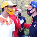 ZANDVOORT, NETHERLANDS - SEPTEMBER 05: Max Verstappen of Netherlands and Red Bull Racing and Daniel Ricciardo of Australia and McLaren F1 talk on the drivers parade ahead of the F1 Grand Prix of The Netherlands at Circuit Zandvoort on September 05, 2021 in Zandvoort, Netherlands. (Photo by Peter Fox/Getty Images)