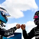 PORTIMAO, PORTUGAL - MAY 01: Pole position qualifier Valtteri Bottas of Finland and Mercedes GP interacts with teammate and second placed qualifier Lewis Hamilton of Great Britain and Mercedes GP in parc ferme after qualifying for the F1 Grand Prix of Portugal at Autodromo Internacional Do Algarve on May 01, 2021 in Portimao, Portugal. (Photo by Gabriel Bouys - Pool/Getty Images)