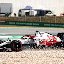 PORTIMAO, PORTUGAL - MAY 02: Kimi Raikkonen of Finland driving the (7) Alfa Romeo Racing C41 Ferrari in the gravel with a broken front wing during the F1 Grand Prix of Portugal at Autodromo Internacional Do Algarve on May 02, 2021 in Portimao, Portugal. (Photo by Bryn Lennon/Getty Images)