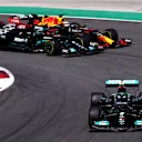 PORTIMAO, PORTUGAL - MAY 02: Valtteri Bottas of Finland driving the (77) Mercedes AMG Petronas F1 Team Mercedes W12 leads Lewis Hamilton of Great Britain driving the (44) Mercedes AMG Petronas F1 Team Mercedes W12 and Max Verstappen of the Netherlands driving the (33) Red Bull Racing RB16B Honda on track during the F1 Grand Prix of Portugal at Autodromo Internacional Do Algarve on May 02, 2021 in Portimao, Portugal. (Photo by Lars Baron/Getty Images)