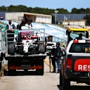 PORTIMAO, PORTUGAL - MAY 02: The car of Kimi Raikkonen of Finland and Alfa Romeo Racing is seen on a tow truck after stopping in the gravel with a broken front wing during the F1 Grand Prix of Portugal at Autodromo Internacional Do Algarve on May 02, 2021 in Portimao, Portugal. (Photo by Bryn Lennon/Getty Images)