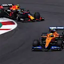 PORTIMAO, PORTUGAL - MAY 02: Lando Norris of Great Britain driving the (4) McLaren F1 Team MCL35M Mercedes leads Sergio Perez of Mexico driving the (11) Red Bull Racing RB16B Honda on track during the F1 Grand Prix of Portugal at Autodromo Internacional Do Algarve on May 02, 2021 in Portimao, Portugal. (Photo by Lars Baron/Getty Images)