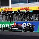 PORTIMAO, PORTUGAL - MAY 02: Mercedes GP team members celebrate on the pitwall as Lewis Hamilton of Great Britain driving the (44) Mercedes AMG Petronas F1 Team Mercedes W12 crosses the finish line to win during the F1 Grand Prix of Portugal at Autodromo Internacional Do Algarve on May 02, 2021 in Portimao, Portugal. (Photo by Lars Baron/Getty Images)