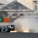DOHA, QATAR - NOVEMBER 19: Sparks fly behind Pierre Gasly of France driving the (10) Scuderia AlphaTauri AT02 Honda during practice ahead of the F1 Grand Prix of Qatar at Losail International Circuit on November 19, 2021 in Doha, Qatar. (Photo by Clive Mason/Getty Images)