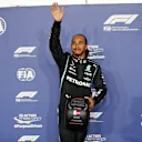 DOHA, QATAR - NOVEMBER 20: Pole position qualifier Lewis Hamilton of Great Britain and Mercedes GP waves to the crowd in parc ferme during qualifying ahead of the F1 Grand Prix of Qatar at Losail International Circuit on November 20, 2021 in Doha, Qatar. (Photo by Hamad I Mohammed - Pool/Getty Images)