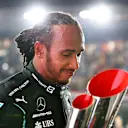 DOHA, QATAR - NOVEMBER 21: Race winner Lewis Hamilton of Great Britain and Mercedes GP celebrates on the podium during the F1 Grand Prix of Qatar at Losail International Circuit on November 21, 2021 in Doha, Qatar. (Photo by Dan Istitene - Formula 1/Formula 1 via Getty Images)