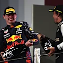 DOHA, QATAR - NOVEMBER 21: Second placed Max Verstappen of Netherlands and Red Bull Racing and Third placed Fernando Alonso of Spain and Alpine F1 Team celebrate on the podium during the F1 Grand Prix of Qatar at Losail International Circuit on November 21, 2021 in Doha, Qatar. (Photo by Mark Thompson/Getty Images)