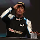 DOHA, QATAR - NOVEMBER 21: Third placed Fernando Alonso of Spain and Alpine F1 Team celebrates on the podium during the F1 Grand Prix of Qatar at Losail International Circuit on November 21, 2021 in Doha, Qatar. (Photo by Lars Baron/Getty Images)