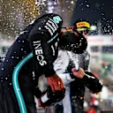 DOHA, QATAR - NOVEMBER 21: Race winner Lewis Hamilton of Great Britain and Mercedes GP, Second placed Max Verstappen of Netherlands and Red Bull Racing and Third placed Fernando Alonso of Spain and Alpine F1 Team celebrate on the podium during the F1 Grand Prix of Qatar at Losail International Circuit on November 21, 2021 in Doha, Qatar. (Photo by Dan Istitene - Formula 1/Formula 1 via Getty Images)