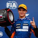 SOCHI, RUSSIA - SEPTEMBER 25: Pole position qualifier Lando Norris of Great Britain and McLaren F1 celebrates in parc ferme during qualifying ahead of the F1 Grand Prix of Russia at Sochi Autodrom on September 25, 2021 in Sochi, Russia. (Photo by Yuri Kochetkov - Pool/Getty Images)