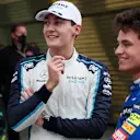 SOCHI, RUSSIA - SEPTEMBER 25: Pole position qualifier Lando Norris of Great Britain and McLaren F1 talks with third place qualifier George Russell of Great Britain and Williams in parc ferme during qualifying ahead of the F1 Grand Prix of Russia at Sochi Autodrom on September 25, 2021 in Sochi, Russia. (Photo by Yuri Kochetkov - Pool/Getty Images)