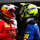 SOCHI, RUSSIA - SEPTEMBER 25: Pole position qualifier Lando Norris of Great Britain and McLaren F1 talks with second place qualifier Carlos Sainz of Spain and Ferrari in parc ferme during qualifying ahead of the F1 Grand Prix of Russia at Sochi Autodrom on September 25, 2021 in Sochi, Russia. (Photo by Dan Istitene - Formula 1/Formula 1 via Getty Images)