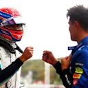 SOCHI, RUSSIA - SEPTEMBER 25: Pole position qualifier Lando Norris of Great Britain and McLaren F1 talks with third place qualifier George Russell of Great Britain and Williams in parc ferme during qualifying ahead of the F1 Grand Prix of Russia at Sochi Autodrom on September 25, 2021 in Sochi, Russia. (Photo by Dan Istitene - Formula 1/Formula 1 via Getty Images)