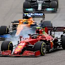 SOCHI, RUSSIA - SEPTEMBER 26: Carlos Sainz of Spain driving the (55) Scuderia Ferrari SF21 leads Lando Norris of Great Britain driving the (4) McLaren F1 Team MCL35M Mercedes into turn two at the start during the F1 Grand Prix of Russia at Sochi Autodrom on September 26, 2021 in Sochi, Russia. (Photo by Bryn Lennon/Getty Images)