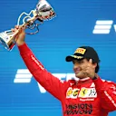 SOCHI, RUSSIA - SEPTEMBER 26: Third placed Carlos Sainz of Spain and Ferrari celebrates on the podium during the F1 Grand Prix of Russia at Sochi Autodrom on September 26, 2021 in Sochi, Russia. (Photo by Mark Thompson/Getty Images)