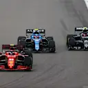 SOCHI, RUSSIA - SEPTEMBER 26: Carlos Sainz of Spain driving the (55) Scuderia Ferrari SF21 leads Esteban Ocon of France driving the (31) Alpine A521 Renault and Pierre Gasly of France driving the (10) Scuderia AlphaTauri AT02 Honda during the F1 Grand Prix of Russia at Sochi Autodrom on September 26, 2021 in Sochi, Russia. (Photo by Bryn Lennon/Getty Images)