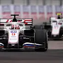 SOCHI, RUSSIA - SEPTEMBER 26: Nikita Mazepin of Russia driving the (9) Haas F1 Team VF-21 Ferrari leads Mick Schumacher of Germany driving the (47) Haas F1 Team VF-21 Ferrari during the F1 Grand Prix of Russia at Sochi Autodrom on September 26, 2021 in Sochi, Russia. (Photo by Lars Baron - Formula 1/Formula 1 via Getty Images)