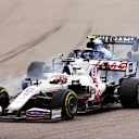 SOCHI, RUSSIA - SEPTEMBER 26: Nikita Mazepin of Russia driving the (9) Haas F1 Team VF-21 Ferrari leads Nicholas Latifi of Canada driving the (6) Williams Racing FW43B Mercedes during the F1 Grand Prix of Russia at Sochi Autodrom on September 26, 2021 in Sochi, Russia. (Photo by Bryn Lennon/Getty Images)