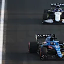 JEDDAH, SAUDI ARABIA - DECEMBER 03: Fernando Alonso of Spain driving the (14) Alpine A521 Renault leads George Russell of Great Britain driving the (63) Williams Racing FW43B Mercedes during practice ahead of the F1 Grand Prix of Saudi Arabia at Jeddah Corniche Circuit on December 03, 2021 in Jeddah, Saudi Arabia. (Photo by Bryn Lennon - Formula 1/Formula 1 via Getty Images)