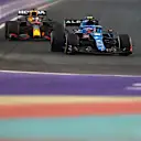 JEDDAH, SAUDI ARABIA - DECEMBER 03: Esteban Ocon of France driving the (31) Alpine A521 Renault leads Max Verstappen of the Netherlands driving the (33) Red Bull Racing RB16B Honda during practice ahead of the F1 Grand Prix of Saudi Arabia at Jeddah Corniche Circuit on December 03, 2021 in Jeddah, Saudi Arabia. (Photo by Bryn Lennon - Formula 1/Formula 1 via Getty Images)