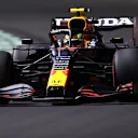 JEDDAH, SAUDI ARABIA - DECEMBER 03:Sergio Perez of Mexico driving the (11) Red Bull Racing RB16B Honda  during practice ahead of the F1 Grand Prix of Saudi Arabia at Jeddah Corniche Circuit on December 03, 2021 in Jeddah, Saudi Arabia. (Photo by Lars Baron/Getty Images)