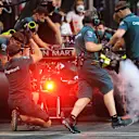 JEDDAH, SAUDI ARABIA - DECEMBER 04: Lance Stroll of Canada driving the (18) Aston Martin AMR21 Mercedes stops in the Pitlane during qualifying ahead of the F1 Grand Prix of Saudi Arabia at Jeddah Corniche Circuit on December 04, 2021 in Jeddah, Saudi Arabia. (Photo by Giuseppe Cacace - Pool/Getty Images)