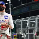 JEDDAH, SAUDI ARABIA - DECEMBER 04: Mick Schumacher of Germany and Haas F1 walks in the Pitlane during qualifying ahead of the F1 Grand Prix of Saudi Arabia at Jeddah Corniche Circuit on December 04, 2021 in Jeddah, Saudi Arabia. (Photo by Mark Thompson/Getty Images)
