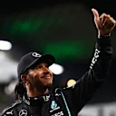 JEDDAH, SAUDI ARABIA - DECEMBER 04: Pole position qualifier Lewis Hamilton of Great Britain and Mercedes GP celebrates in parc ferme during qualifying ahead of the F1 Grand Prix of Saudi Arabia at Jeddah Corniche Circuit on December 04, 2021 in Jeddah, Saudi Arabia. (Photo by Bryn Lennon - Formula 1/Formula 1 via Getty Images)