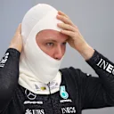 JEDDAH, SAUDI ARABIA - DECEMBER 04: Valtteri Bottas of Finland and Mercedes GP prepares to drive in the garage during final practice ahead of the F1 Grand Prix of Saudi Arabia at Jeddah Corniche Circuit on December 04, 2021 in Jeddah, Saudi Arabia. (Photo by Bryn Lennon - Formula 1/Formula 1 via Getty Images)