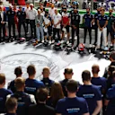 JEDDAH, SAUDI ARABIA - DECEMBER 05: The F1 community stands for a minutes silence in tribute to the late Sir Frank Williams ahead of the F1 Grand Prix of Saudi Arabia at Jeddah Corniche Circuit on December 05, 2021 in Jeddah, Saudi Arabia. (Photo by Mark Thompson/Getty Images)