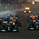 JEDDAH, SAUDI ARABIA - DECEMBER 05: Lewis Hamilton of Great Britain driving the (44) Mercedes AMG Petronas F1 Team Mercedes W12 leads Valtteri Bottas of Finland driving the (77) Mercedes AMG Petronas F1 Team Mercedes W12 and the rest of the field into turn one at the start during the F1 Grand Prix of Saudi Arabia at Jeddah Corniche Circuit on December 05, 2021 in Jeddah, Saudi Arabia. (Photo by Joe Portlock - Formula 1/Formula 1 via Getty Images)