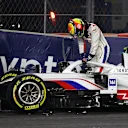 JEDDAH, SAUDI ARABIA - DECEMBER 05: Mick Schumacher of Germany driving the (47) Haas F1 Team VF-21 Ferrari climbs from his car after crashing during the F1 Grand Prix of Saudi Arabia at Jeddah Corniche Circuit on December 05, 2021 in Jeddah, Saudi Arabia. (Photo by Bryn Lennon - Formula 1/Formula 1 via Getty Images)