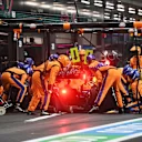 JEDDAH, SAUDI ARABIA - DECEMBER 05: Lando Norris of Great Britain driving the (4) McLaren F1 Team MCL35M Mercedes makes a pitstop during the F1 Grand Prix of Saudi Arabia at Jeddah Corniche Circuit on December 05, 2021 in Jeddah, Saudi Arabia. (Photo by Andrej Isakovic - Pool/Getty Images)