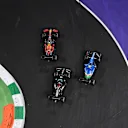 JEDDAH, SAUDI ARABIA - DECEMBER 05: Max Verstappen of the Netherlands driving the (33) Red Bull Racing RB16B Honda leads the field into turn one ahead of Lewis Hamilton of Great Britain driving the (44) Mercedes AMG Petronas F1 Team Mercedes W12 and Esteban Ocon of France driving the (31) Alpine A521 Renault at the second restart during the F1 Grand Prix of Saudi Arabia at Jeddah Corniche Circuit on December 05, 2021 in Jeddah, Saudi Arabia. (Photo by Dan Mullan/Getty Images)