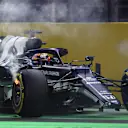 JEDDAH, SAUDI ARABIA - DECEMBER 05: Yuki Tsunoda of Japan driving the (22) Scuderia AlphaTauri AT02 Honda with a broken front wing and flaming brakes after a crash  during the F1 Grand Prix of Saudi Arabia at Jeddah Corniche Circuit on December 05, 2021 in Jeddah, Saudi Arabia. (Photo by Joe Portlock - Formula 1/Formula 1 via Getty Images)