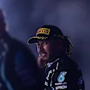 JEDDAH, SAUDI ARABIA - DECEMBER 05: Race winner Lewis Hamilton of Great Britain and Mercedes GP celebrates on the podium during the F1 Grand Prix of Saudi Arabia at Jeddah Corniche Circuit on December 05, 2021 in Jeddah, Saudi Arabia. (Photo by Mario Renzi - Formula 1/Formula 1 via Getty Images)