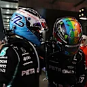 JEDDAH, SAUDI ARABIA - DECEMBER 05: Race winner Lewis Hamilton of Great Britain and Mercedes GP and third placed Valtteri Bottas of Finland and Mercedes GP celebrate in parc ferme during the F1 Grand Prix of Saudi Arabia at Jeddah Corniche Circuit on December 05, 2021 in Jeddah, Saudi Arabia. (Photo by Bryn Lennon - Formula 1/Formula 1 via Getty Images)