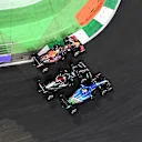 JEDDAH, SAUDI ARABIA - DECEMBER 05: Esteban Ocon of France driving the (31) Alpine A521 Renault, Lewis Hamilton of Great Britain driving the (44) Mercedes AMG Petronas F1 Team Mercedes W12 and Max Verstappen of the Netherlands driving the (33) Red Bull Racing RB16B Honda battle for track position at the second restart during the F1 Grand Prix of Saudi Arabia at Jeddah Corniche Circuit on December 05, 2021 in Jeddah, Saudi Arabia. (Photo by Dan Mullan/Getty Images)