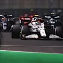 JEDDAH, SAUDI ARABIA - DECEMBER 05: Antonio Giovinazzi of Italy driving the (99) Alfa Romeo Racing C41 Ferrari leads Yuki Tsunoda of Japan driving the (22) Scuderia AlphaTauri AT02 Honda during the F1 Grand Prix of Saudi Arabia at Jeddah Corniche Circuit on December 05, 2021 in Jeddah, Saudi Arabia. (Photo by Lars Baron/Getty Images)