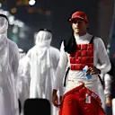 JEDDAH, SAUDI ARABIA - DECEMBER 05: Carlos Sainz of Spain and Ferrari prepares to drive on the grid during the F1 Grand Prix of Saudi Arabia at Jeddah Corniche Circuit on December 05, 2021 in Jeddah, Saudi Arabia. (Photo by Bryn Lennon - Formula 1/Formula 1 via Getty Images)