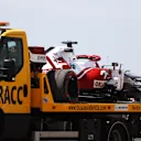 BARCELONA, SPAIN - MAY 07: The car of Robert Kubica of Poland and Alfa Romeo Racing is seen on a tow truck after stopping on track during practice for the F1 Grand Prix of Spain at Circuit de Barcelona-Catalunya on May 07, 2021 in Barcelona, Spain. (Photo by Bryn Lennon/Getty Images)