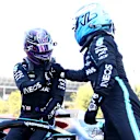 BARCELONA, SPAIN - MAY 08: Pole position qualifier Lewis Hamilton of Great Britain and Mercedes GP interacts with teammate and third placed qualifier Valtteri Bottas of Finland and Mercedes GP in parc ferme during qualifying for the F1 Grand Prix of Spain at Circuit de Barcelona-Catalunya on May 08, 2021 in Barcelona, Spain. (Photo by Dan Istitene - Formula 1/Formula 1 via Getty Images)