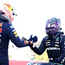 BARCELONA, SPAIN - MAY 08: Pole position qualifier Lewis Hamilton of Great Britain and Mercedes GP shakes hands with second place qualifier Max Verstappen of Netherlands and Red Bull Racing in parc ferme during qualifying for the F1 Grand Prix of Spain at Circuit de Barcelona-Catalunya on May 08, 2021 in Barcelona, Spain. (Photo by Dan Istitene - Formula 1/Formula 1 via Getty Images)