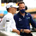 BARCELONA, SPAIN - MAY 09: George Russell of Great Britain and Williams prepares to drive on the grid with a team member prior to the F1 Grand Prix of Spain at Circuit de Barcelona-Catalunya on May 09, 2021 in Barcelona, Spain. (Photo by Bryn Lennon/Getty Images)