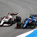 BARCELONA, SPAIN - MAY 09: Esteban Ocon of France driving the (31) Alpine A521 Renault and Antonio Giovinazzi of Italy driving the (99) Alfa Romeo Racing C41 Ferrari compete for position on track during the F1 Grand Prix of Spain at Circuit de Barcelona-Catalunya on May 09, 2021 in Barcelona, Spain. (Photo by Bryn Lennon/Getty Images)