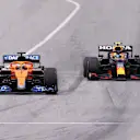 BARCELONA, SPAIN - MAY 09: Daniel Ricciardo of Australia driving the (3) McLaren F1 Team MCL35M Mercedes and Sergio Perez of Mexico driving the (11) Red Bull Racing RB16B Honda on track during the F1 Grand Prix of Spain at Circuit de Barcelona-Catalunya on May 09, 2021 in Barcelona, Spain. (Photo by Lars Baron/Getty Images)